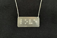 Load image into Gallery viewer, A functional, tactile braille necklace that reads "love" in grade 2 braille. The piece is bright, polished silver.