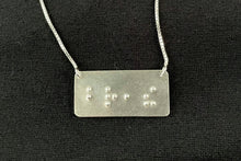 Load image into Gallery viewer, A functional, tactile braille necklace that reads "breathe" in grade 2 braille. The piece is shiny, polished silver.