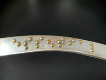 Load image into Gallery viewer, A close up some of the braille on this necklace. It reads "essential" in gold braille.