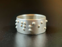 Load image into Gallery viewer, A sterling silver ring reading "persist" in accurate, functional, grade 2 braille.
