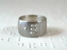 Load image into Gallery viewer, A sterling silver ring reading "question" in accurate, functional, grade 2 braille.