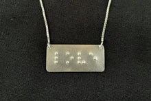 Load image into Gallery viewer, A functional, tactile braille necklace that reads &quot;love&quot; in grade 2 braille. The piece is bright, polished silver.
