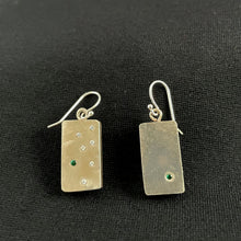 Load image into Gallery viewer, Polished rectangular silver earrings. The one on the left has a single emerald in the lower right. The earring on the right has a scattering of 6 moissanite with a single emerald.
