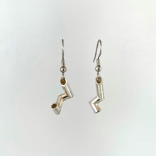 Load image into Gallery viewer, A pair of earrings made from sterling silver tubing. Each is cut and soldered at sharp angles into an interesting shape, and are not symmetrical.
