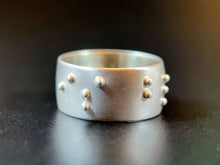 Load image into Gallery viewer, A sterling silver ring with the words &quot;is blind&quot; in accurate, functional, grade 2 braille.
