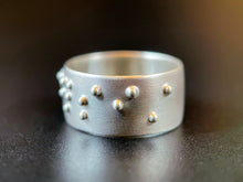 Load image into Gallery viewer, A sterling silver ring reading &quot;persist&quot; in accurate, functional, grade 2 braille.
